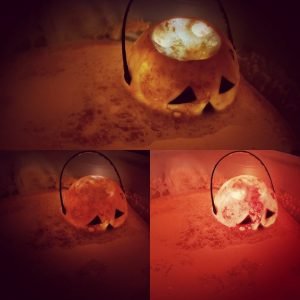 Trio of pictures showing the Horseman's Head bath bomb in use in water. It is various states of lighting from the light cube inside.